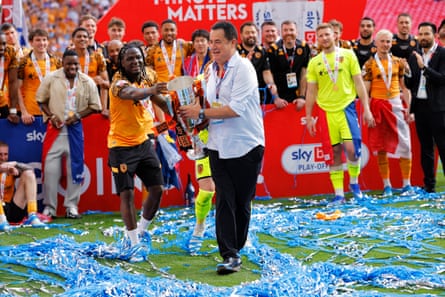 The Hull owner, Acun Ilicali, lifts the Championship playoff final trophy.