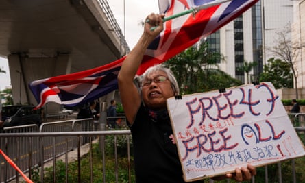 A pro-democracy activist known as Grandma Wong protests outside the West Kowloon courts last November in a cordoned-off area set up by police during Hong Kong’s largest national security trial of 47 pro-democracy figures