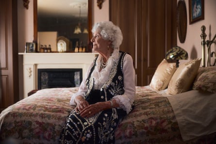 Phyllis Broadbent sat on her bed in her pearly outfit