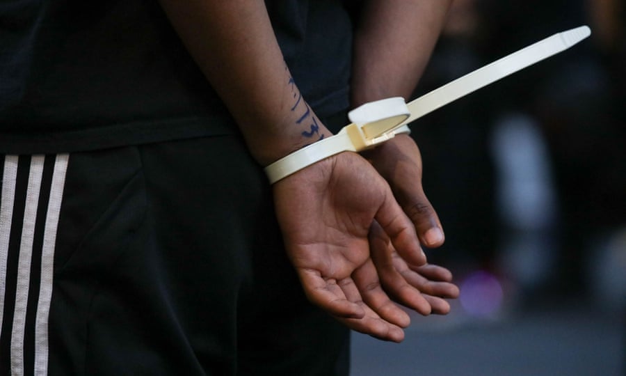 A protester is arrested in Washington DC during a protest over the death of George Floyd.