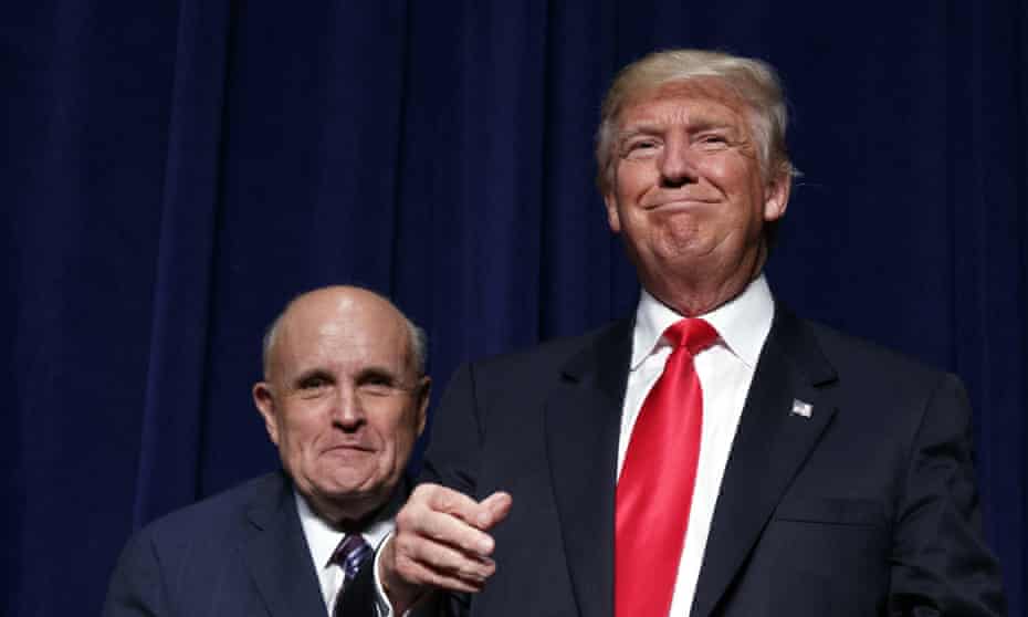 Donald Trump, right, stands with former New York mayor Rudy Giuliani during a campaign rally in North Carolina.