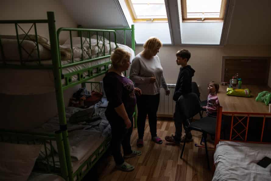 Olga Salko, her sister Taiyana and daughter Sophia stand with Nikita, another displaced Ukrainian in temporary accommodation, Moldova.