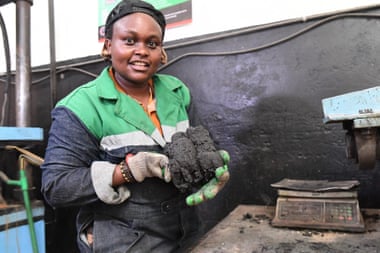 Nzambi Matee holds extracted plastic polymer, which can be used to make bricks.