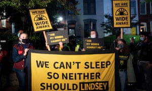 Protesters gather outside the residence of Senator Lindsey Graham, in Washington.