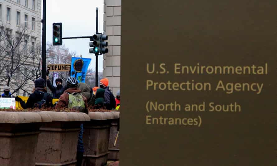 Climate crisis activists with ShutDownDC march in Washington DC from the Environmental Protection Agency to the White House.