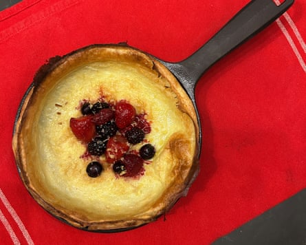 dutch baby in a cast iron skillet on table