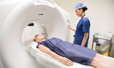 Model release of a CT scan being carried out.
