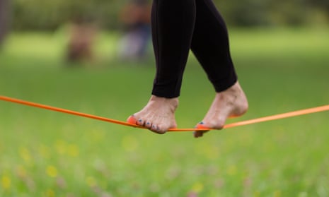 Woman balancing on a low tightrope