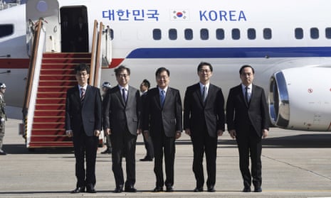 A group of high-level South Korean officials pose for photographs before leaving for Pyongyang on Monday.