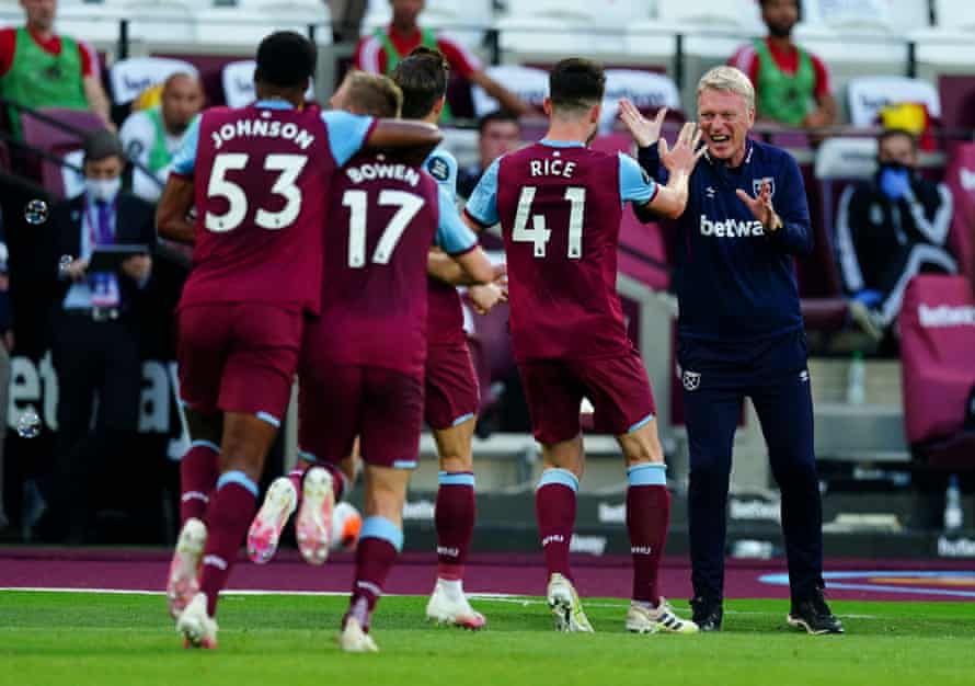 Declan Rice celebrates with David Moyes after scoring for West Ham against Watford in July 2020.