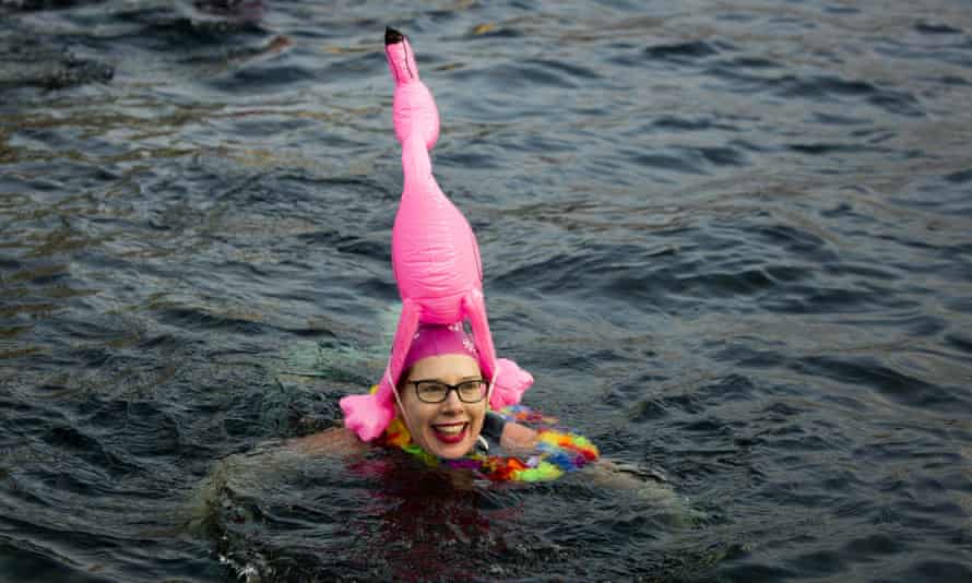 woman in water with flamingo headdress, Salford docks