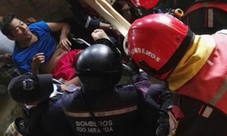 Manuel Vasquez is rescued by a Venezuelan team.