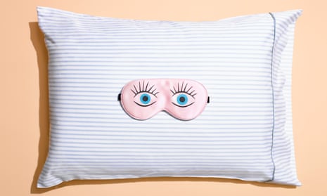 An illustration of a pillow with a picture of wide open eyes on it