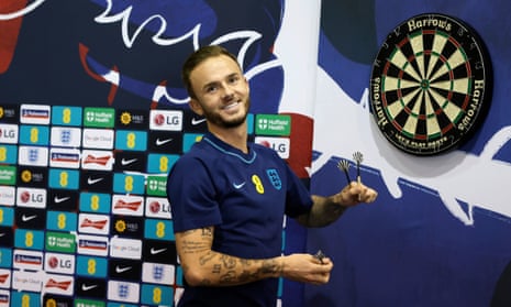 James Maddison plays darts in the media centre after England’s first training session in Qatar.