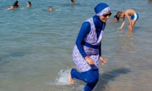 A woman wears a burkini on the beach in Marseille, France.