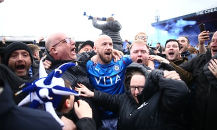 Stockport’s Paddy Madden joins fans to celebrate their promotion at Edgeley Park.