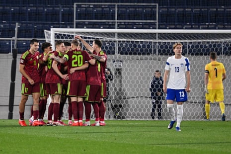 Finland's Juho Lahteenmaki (second right) and keeper Lucas Hradecky (right) react as Belarus' players celebrate their goal scored by Artem Shumanski.