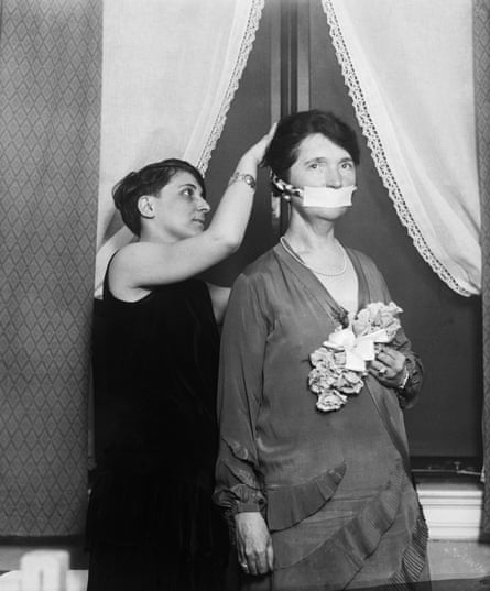 Birth control advocate Margaret Sanger has her mouth covered to protest about not being allowed to talk about birth control in Boston, 1929