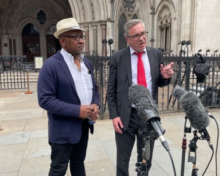 Errol Campbell Jr and Matt Foot outside the Royal Courts of Justice; Foot is speaking to the media.