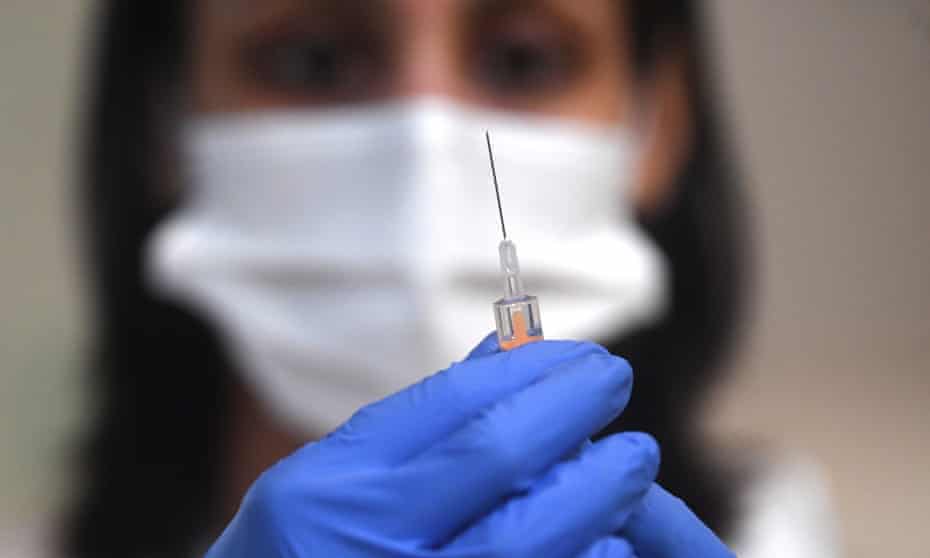 A member of clinical staff prepares the Oxford/AstraZeneca Covid19 vaccine at an NHS vaccination centre in Ealing, west London.