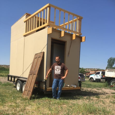 Jim Burleson with a tiny home he built.