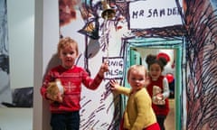 Children explore Winnie-the-Pooh drawings at the V&amp;A Museum in south-west London.
