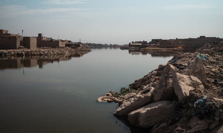 Lakes of sewage waters and refuse on the outskirts of Sadr City.