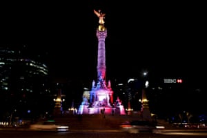 In Mexico City, the Angel de la Independencia monument is lit up in blue, white and red.