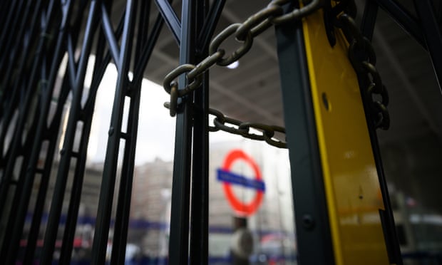 Locked gates block the entrance to Victoria underground station during a strike on 3 March 2022
