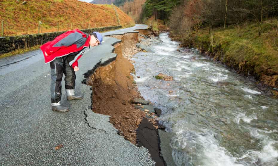 A Cumbria road destroyed in floods during Storm Desmond, which scientists found had been more 40% likely by climate change.