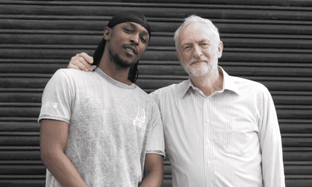 Man do care... JME poses with Jeremy Corbyn.