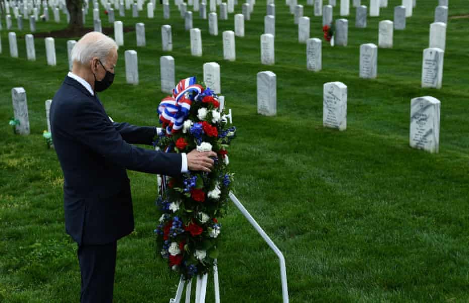 Joe Biden lays a wreath in Arlington National cemetery to honor fallen veterans of the war in Afghanistan on 14 April.