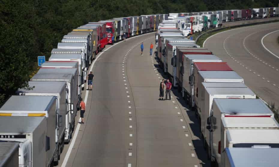  Truck drivers stand next to their vehicles on the M20 during Operation Stack on July 30, 2015 near Charing, Kent. 