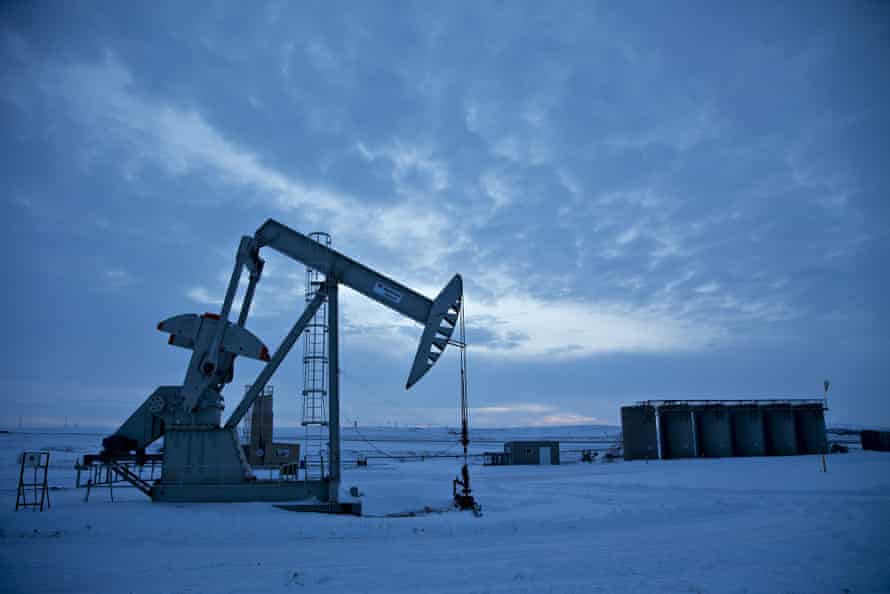 A pumpjack operates above an oilwell in the Bakken Formation outside Williston, North Dakota.