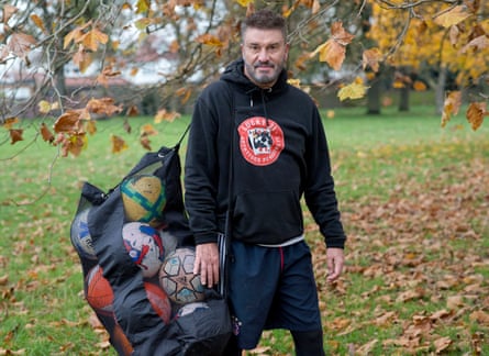 Allan Cockram poses after coaching Down Syndrome children football in Gunnersbury Park, Brentford.