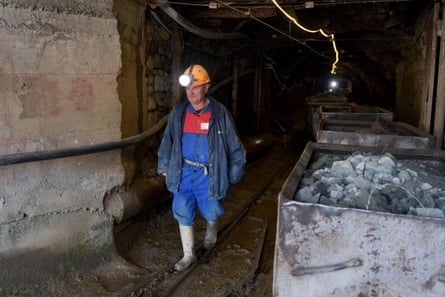 A miner walks inside a chromium mine