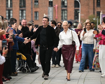 Andy Burnham arrives with his wife, Marie-France van Heel, ahead of the annual Labour Party conference in Liverpool, north-west England, on 26 September.
