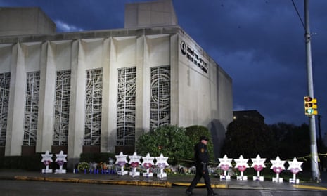 Tree of Life Synagogue and memorial of flowers and stars in remembrance of the those killed and injured when a shooter opened fire during services Saturday.
