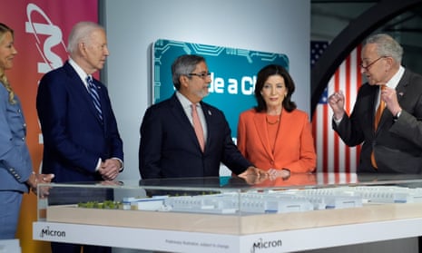 Joe BidenApril Arnzen, Micron Technologies executive vice president and chief people officer with, from left, Joe Biden, Micron Technologies CEO Sanjay Mehrotra, New York Gov. Kathy Hochul and Senate Majority Leader Chuck Schumer. They are looking at a mockup of a semiconductor factory to be built by Micron in Syracuse.