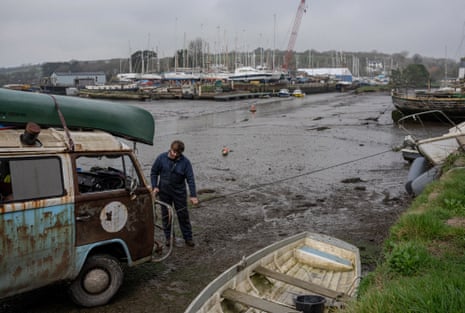 Green uses a winch mounted on the front of his VW van to reposition a previously retrieved boat