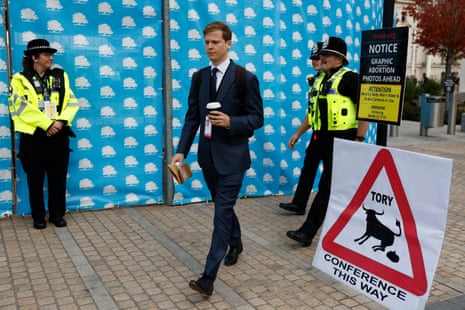 A sign left by a protester outside today's Conservative Party meeting.