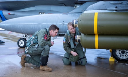US air force pilots inspect a cluster bomb at Hill air force Base, Utah.
