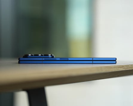 The Samsung Galaxy Z Fold 7 pictured from the side laying flat on a table.