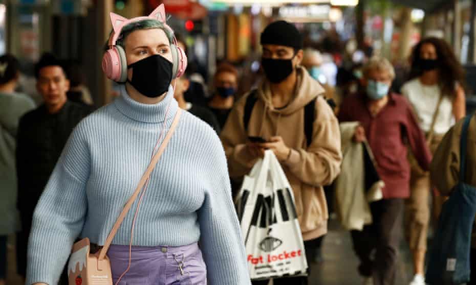 People are seen wearing face masks on Swanston Street, Melbourne
