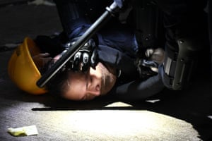 A man is detained by police during clashes in the Wanchai district in Hong Kong.