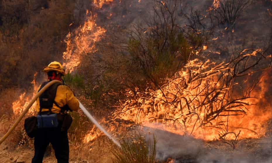 A fire fighter battles the so-called Sand Fire in the Angeles National Forest near Los Angeles, California, United States, July 25, 2016. REUTERS/Gene Blevins