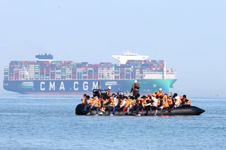 Migrants on a smugglers' boat off the beach of Gravelines, northern France attempt to cross the Channel to England.