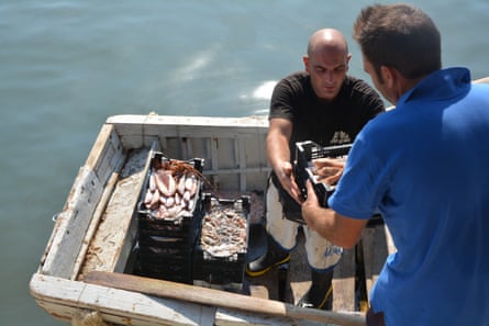 Sakalleo restaurant’s catch of the day is loaded on to the jetty in Scoglitti, Sicily.