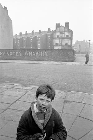 Liverpool, 1969. A young lad on the corner of a Liverpool 8 street