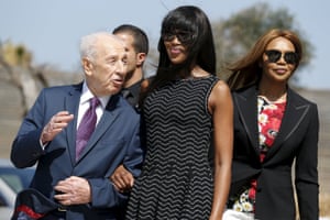 Jaffa, Israel British model Campbell stands with former Israeli President Peres upon her arrival to an event marking International Women’s Day at the at the Peres Center for Peace